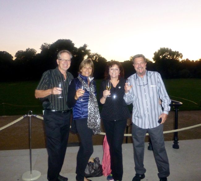 Tom and Tracy with friends toasting