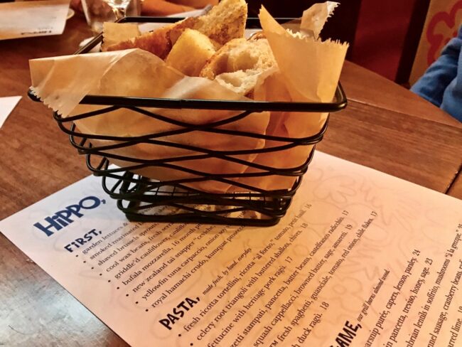 Focaccia bread basket on the table at Hippo Highland Park