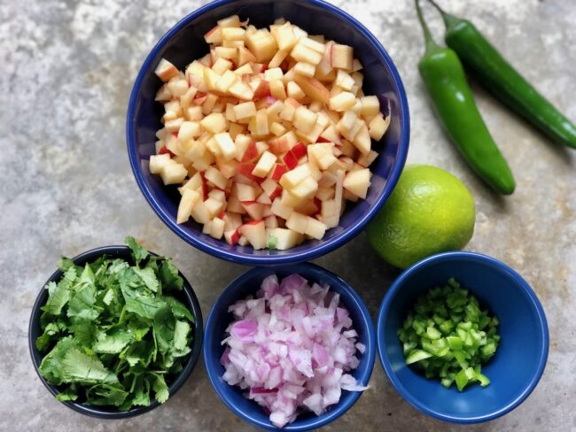 diced apples, cilantro, onion, Jalapenos, and a lime