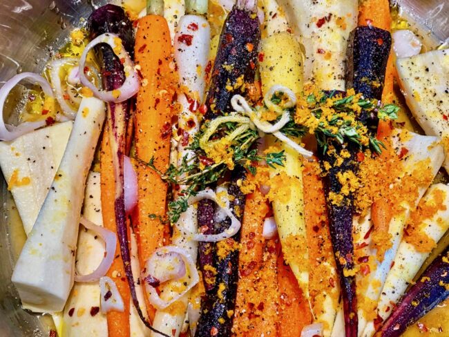 Barefoot Contessa’s Orange-Braised Carrots and Parsnips with crushed black pepper