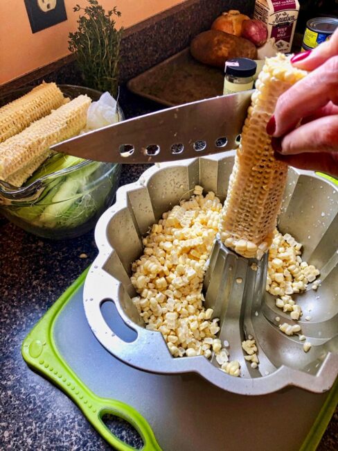 slicing off corn kernels 